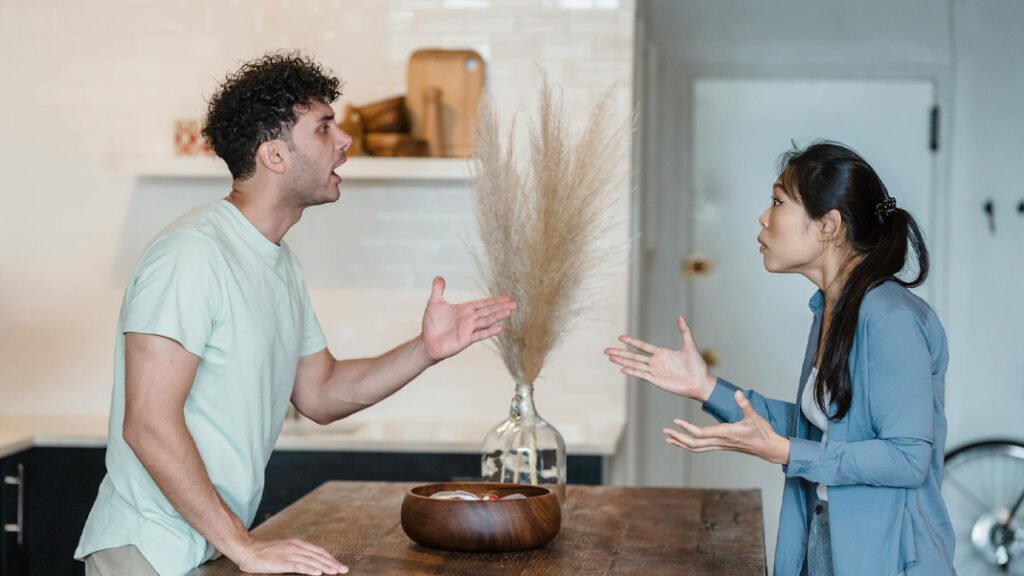 Couple arguing in a dining room