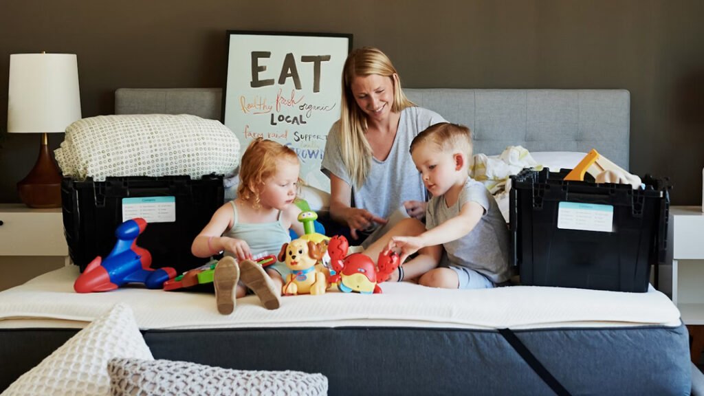 A mom and two kids unpacking and beginning the expat nesting process