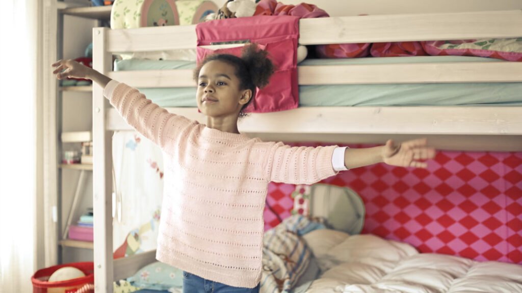 girl nesting and feeling excited in her bedroom